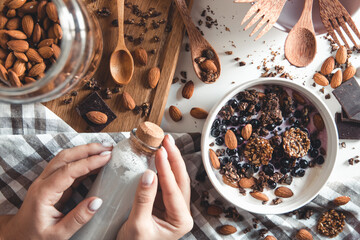A bowl of crunchy homemade granola with almond milk