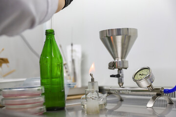 Chemical equipment, dishes, and an alcohol burner.