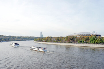 Panorama of Moscow River near Luzhniki Stadium with pleasure boats floating along the river