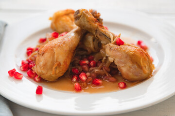 Traditional Armenian New Year's dish of chicken, onion and pomegranate. Armenian cuisine. Stew in gravy. Close-up