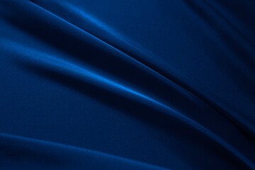 Navy blue elegant abstract background. Silk satin fabric with nice folds. Beautiful dark blue...