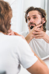 Young fine-looking man skincare beauty portrait isolated in studio.