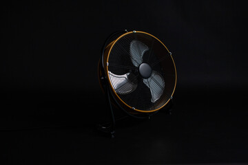 Spectacular fan on a black background, artificial wind