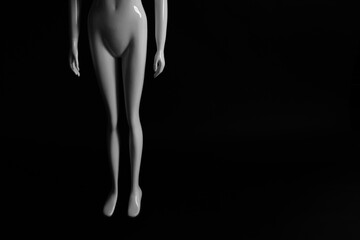 White mannequin on a dark background, background for text