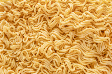 dry raw instant noodles, texture background top view