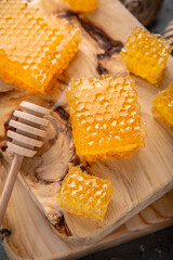 Honey comb. A useful fortified bee product for health and beauty. Vegetarian dietary organic product. Beautiful still life.