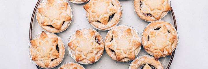 Mince pies, traditional christmas food from all butter shortcrust pastry filled with cranberries, sultanas, currants, raisins, along with festive spices, clementine juice, dash of brandy and cognac