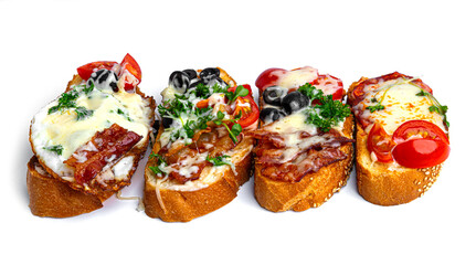 Bruschetta with different fillings on a white background. Vegetables, meat and cheese bruschetta. High quality photo