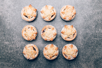 Mince pies, traditional christmas food from all butter shortcrust pastry filled with cranberries, sultanas, currants, raisins, along with festive spices, clementine juice, dash of brandy and cognac