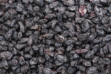 Black raisins, texture background. dried grapes healthy food