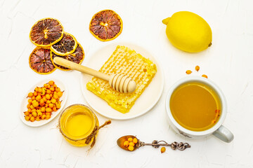 Healing sea-buckthorn tea with honeycombs and lemon