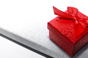 two gift boxes for ring, necklace and other jewelry on white background. long shiny silver box and...