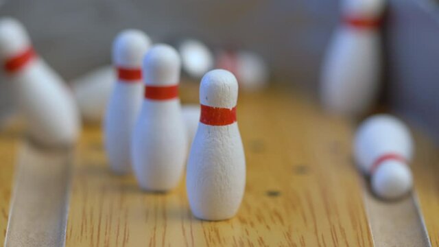Bowling ball on the track in order to knock down the pins