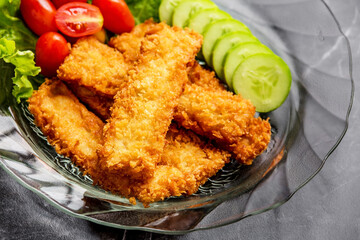 Breaded fried fish with vegetable