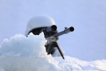 sniper with sniper rifle in the snow