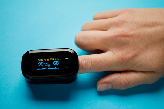 Kiev, Ukraine - 11th November 2020 : Fingertip oximeter. Checking the oxygen level in the blood for pneumonia.