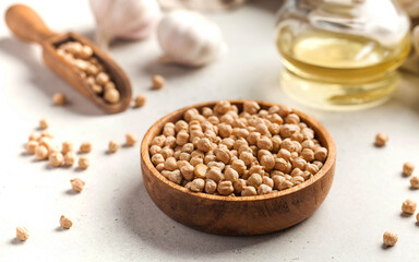 Raw chickpeas in a wooden bowl. Superfood. Copy space.