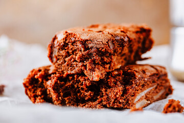 Cake chocolate brownies on on table covered with baking paper