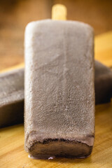 popsicles made of cinnamon and chocolate, cold vegan summer dessert, for diet. Healthy homemade ice pop, without sugar and without gluten.