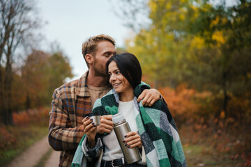 Fototapeta premium Lovely young couple embracing in the park