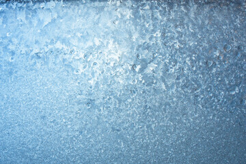 Beautiful natural background or texture of frozen transparent glass on the window in winter, strong cold concept, horizontal image, copy space for your design or text
