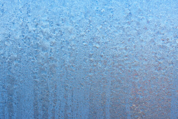 Beautiful natural background or texture of frozen transparent glass on the window in winter, strong cold concept, horizontal image, copy space for your design or text