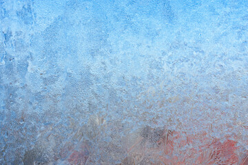 Beautiful natural background or texture of frozen transparent glass on the window in winter, strong...