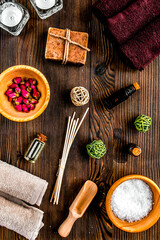 spa set with towels and soap on wooden background top view