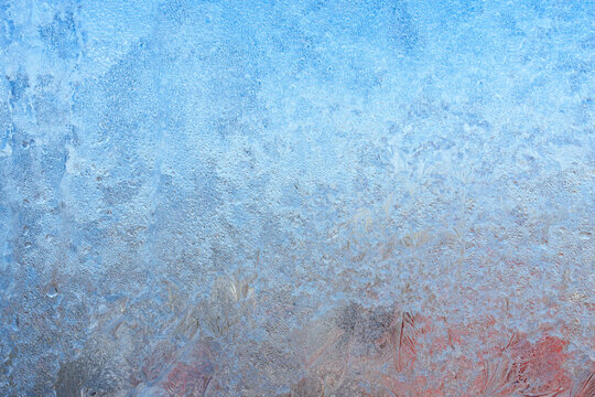 Beautiful natural background or texture of frozen transparent glass on the window in winter, strong cold concept, horizontal image, copy space for your design or text