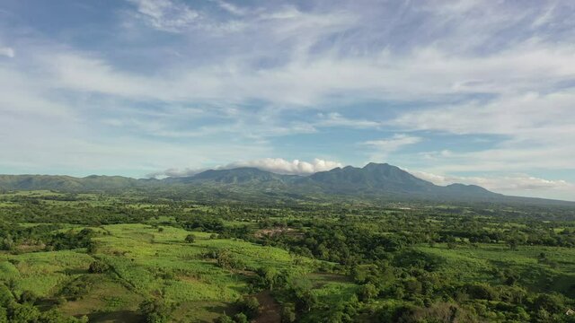 Aerial view of a landscape in Negros Oriental, Philippines, with mountains and clouds. Nature concept. Blue and green scenario. 4k
