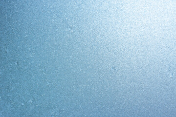 Completely frozen window on transparent glass. Clean background. Extreme low temperatures in winter. Water vapor condenses on cold window glass and freezes