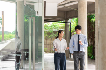 Fototapeta premium business people talking during break discussing new project business outside office in the city