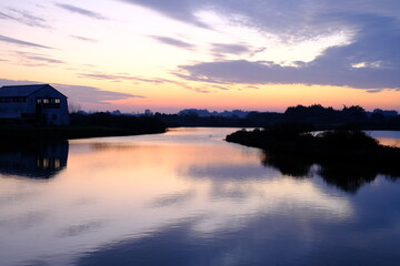 A sunset at the salt marshes of Guerande in the west of France near the Atlantic ocean. (Autumn 2020)