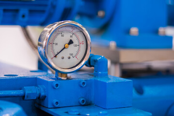 Glycerin pressure gauge for measuring fluid condition at plant, facory - close up. Industrial,...
