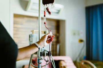 Nurse in hospital with blood products, infusion of donor blood.