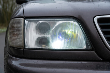 Close-up of the car's fog lights. Headlights in the car, close-up. Close-up of white car headlights. Passing beam. Right headlight © yaroslav1986