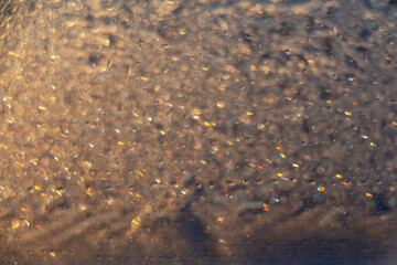 Blurred golden bokeh background for graphic design and wallpaper on Christmas, Easter, Valentine's day. Luxury shining glowing texture. Copy space for text