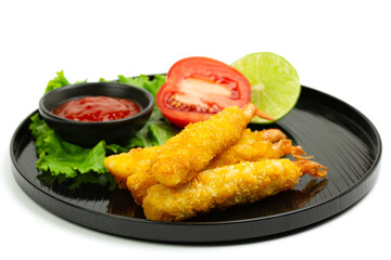 breaded shrimp on black plate isolated on white background