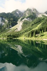 green lake in the mountains with great reflections