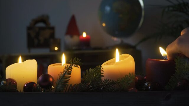 Last advent candle being lit on last Sunday before Christmas, 4k, Stock Footage