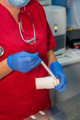 Nurse cutting a piece of tape