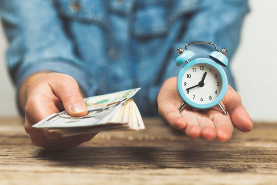 Time and money in hand. Salary per hour of work, income and profit.