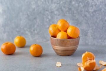Fresh whole clementine fruits on neutral background