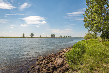 Stones on the banks of a Dutch river provide protection against erosion. The photo was taken in the...