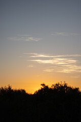 sunset wallpaper in the countryside, view of the sky with orange and yellow tones