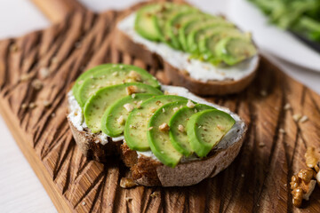 sliced avocado on toast bread with nuts