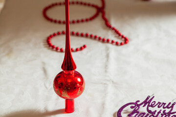 Red top for christmas tree on white background