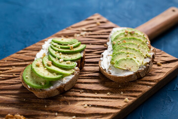 sliced avocado on toast bread with nuts