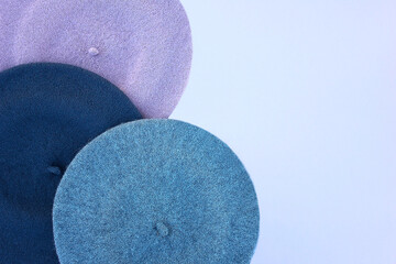 Women's berets in different colors and close-up.