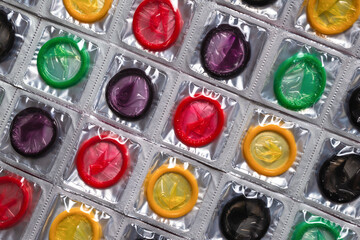 Colorful condoms background.